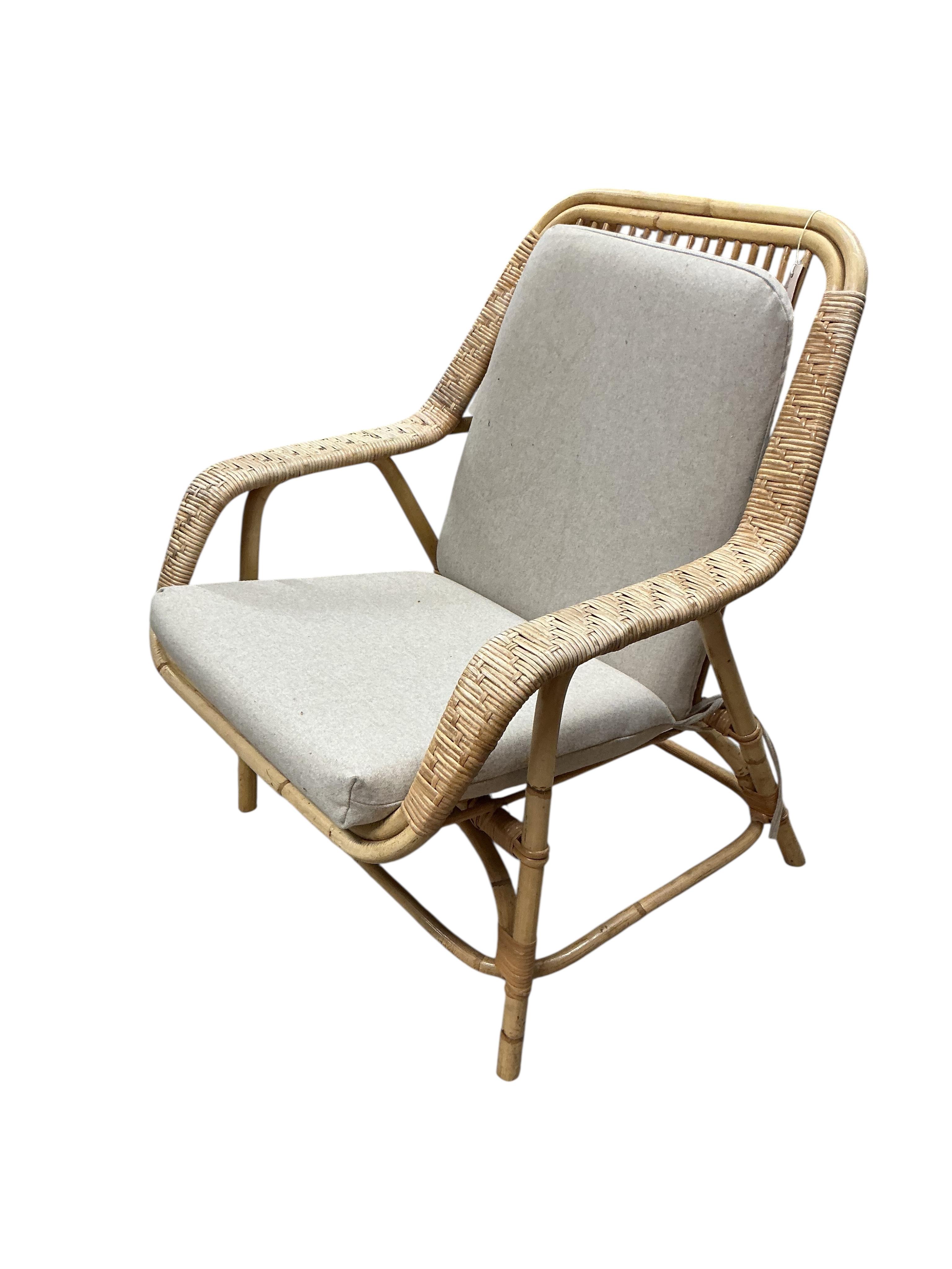A mid century cane and rattan armchair, width 68cm, depth 60cm, height 82cm